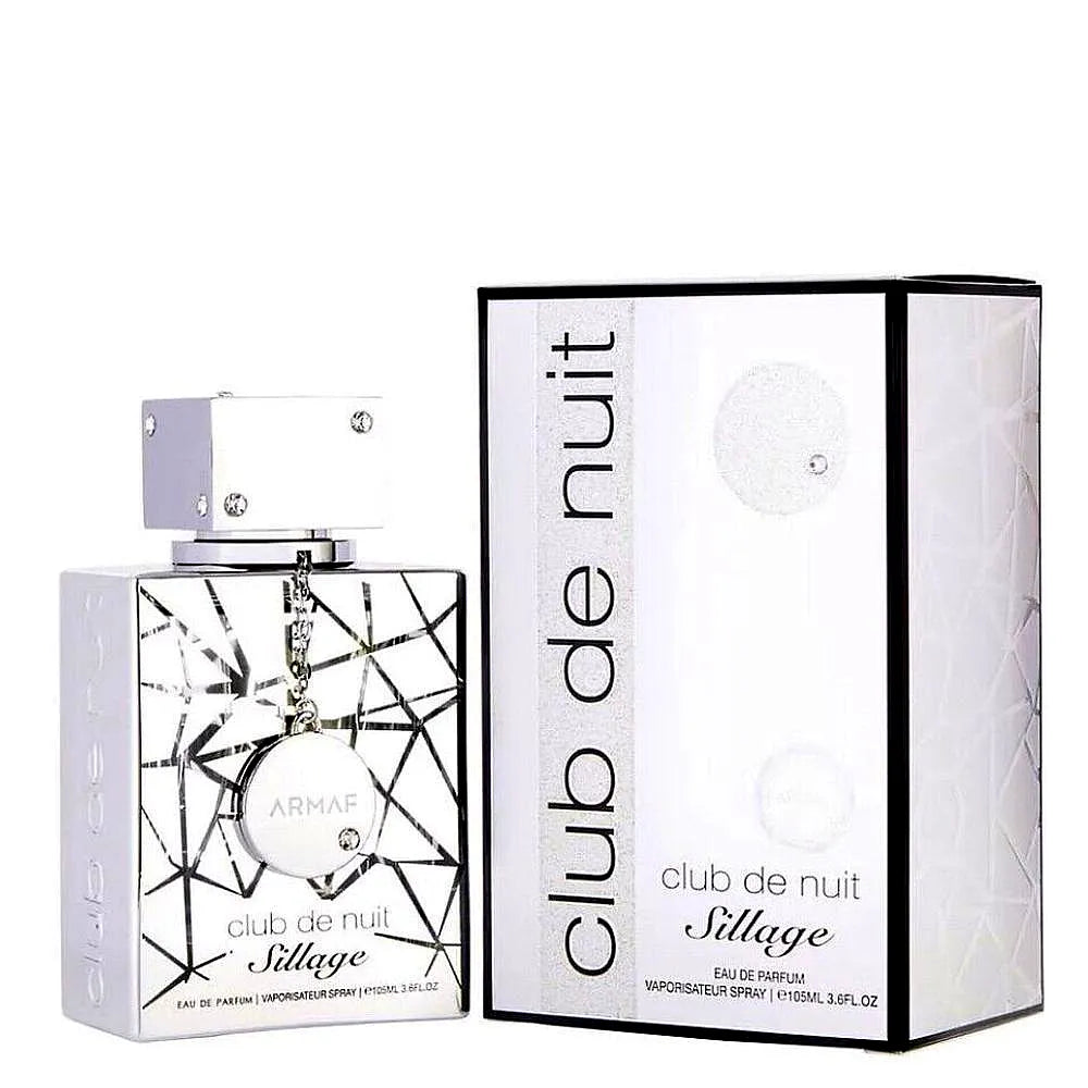 A sleek, modern bottle of Armaf Club de Nuit Sillage Eau de Parfum Mixte, featuring a silver cap and gradient blue glass design, resting on a minimalist background.