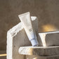 Angle : contre-plongée légère  Editorial luxury skincare photography featuring Beauty of Joseon Relief Sun SPF50+ on sculptural white stone blocks, dramatic sunlight, premium beauty campaign, high-end fashion magazine aesthetic, photorealistic cosmetic advertising. (gemini-3.1-flash-image-preview)