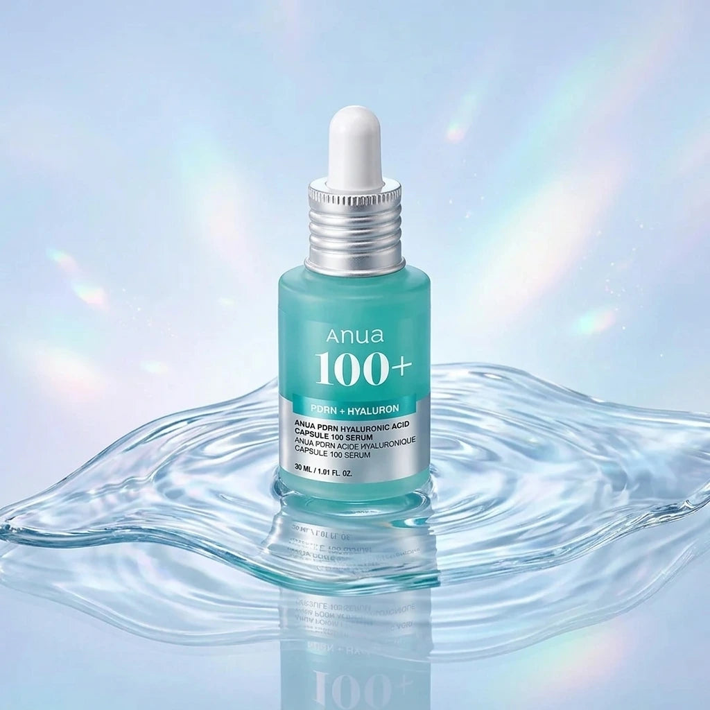 Creative e-commerce shot of Anua PDRN Hyaluronic Acid Serum. The bottle is placed on a wavy, clear glass sheet that mimics a water ripple. The background is a soft gradient of pastel blue and glowing white, with subtle holographic light leaks suggesting intense plumping and moisture. High-end, futuristic skincare aesthetic. Aspect ratio 1:1, size 1200x1200px. (gemini-3.1-flash-image-preview)