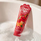 A slight high-angle commercial photograph of a 236ml bottle of "Chupa Chups Cheeky Cherry 2-in-1 shower gel" floating gently in a white porcelain bathtub. The tub is filled with clear water and soft, rich white soap bubbles clustered around the bottle. Calm water ripples. Warm, luxurious bathroom ambient lighting, professional studio setup, sharp details on the product, real life photography, no illustration --ar 4:5 (gemini-3-pro-image-preview)