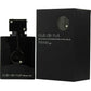 Armaf Club de Nuit Intense Eau de Toilette for men - a sleek, modern men's fragrance bottle with a black cap and silver accents, standing on a reflective surface.
